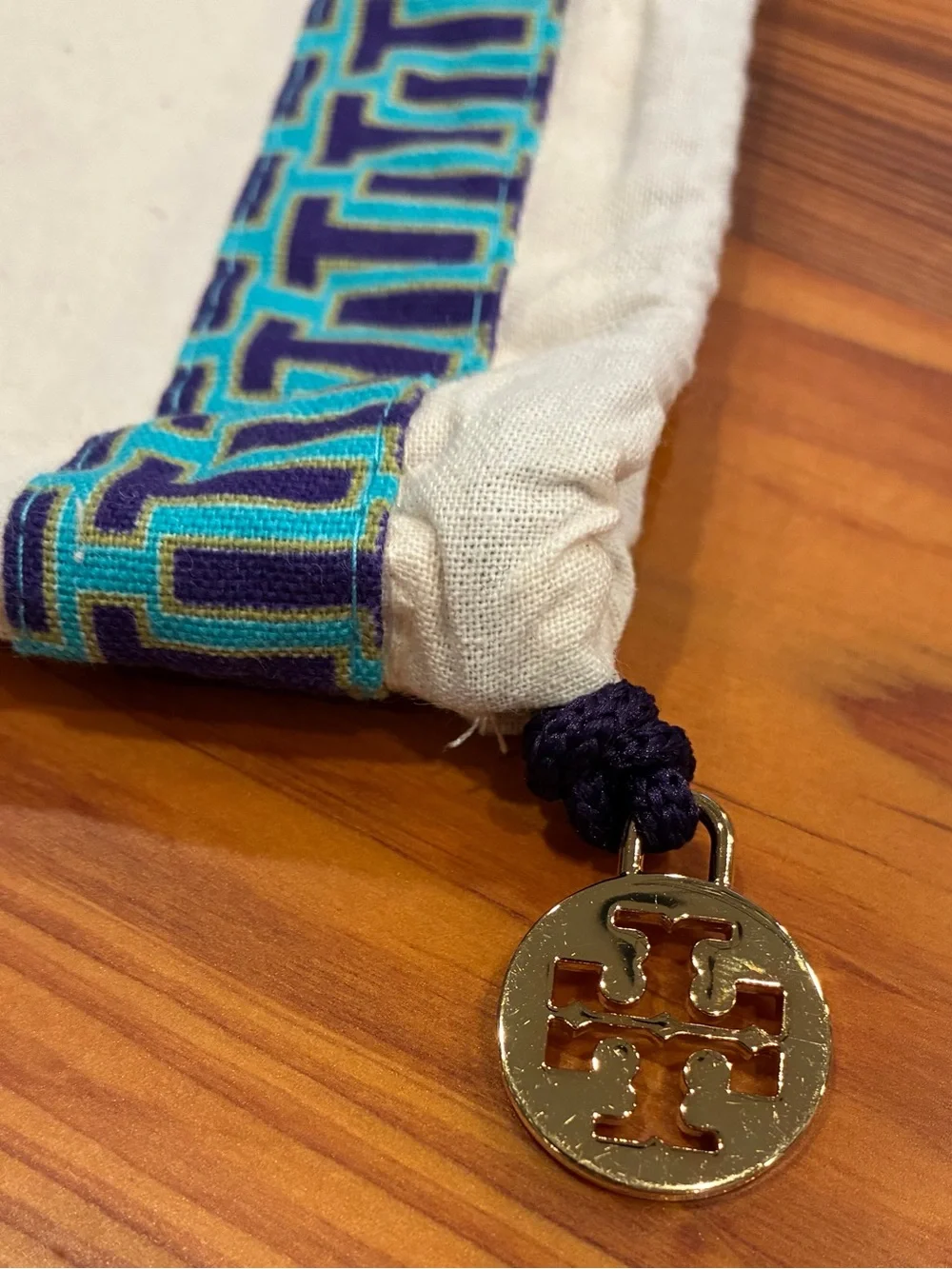 Tory Burch Cream Dust Bag with Navy and Teal Trim & Gold Logo Charm